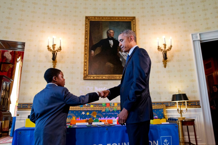 President Barack Obama gives a fist bump to Jacob Leggette, 9, of Baltimore, Md., who creates toys using a 3D printer, while touring the 2016 White House Science Fair at the White House in Washington, D.C., April 13, 2016. (Photo by Jacquelyn Martin/AP)