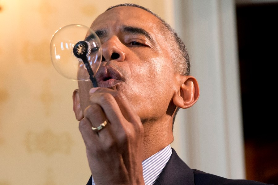 President Barack Obama blows a soap bubble using a 3-D printed bubble wand designed by Jacob Leggette, 9, of Baltimore, Md., while touring the 2016 White House Science Fair at the White House in Washington, D.C., April 13, 2016. Photo by Jacquelyn Martin