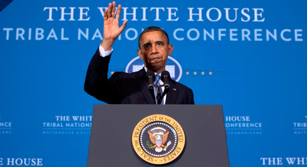 President Barack Obama waves as he arrives to speak at the 2012 Tribal Nations Conference, Wednesday, Dec. 5, 2012, at the Interior Department in Washington. (AP Photo/Carolyn Kaster)