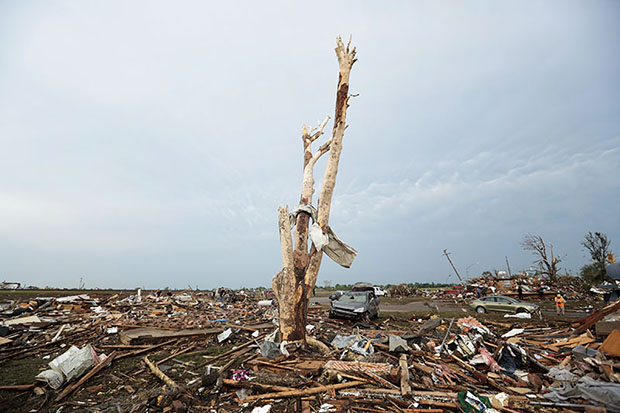 Debris covers the ground after a powerful tornado ripped through the area on May 20, 2013 in Moore, Oklahoma. (Photo by Brett Deering/Getty Images)