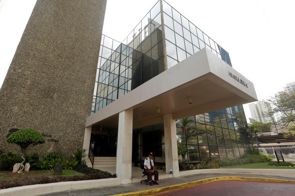 A security guard sit outside the the Mossack Fonseca law firm in Panama City, Sunday, April 3, 2016. (Photo by Arnulfo Franco/AP)
