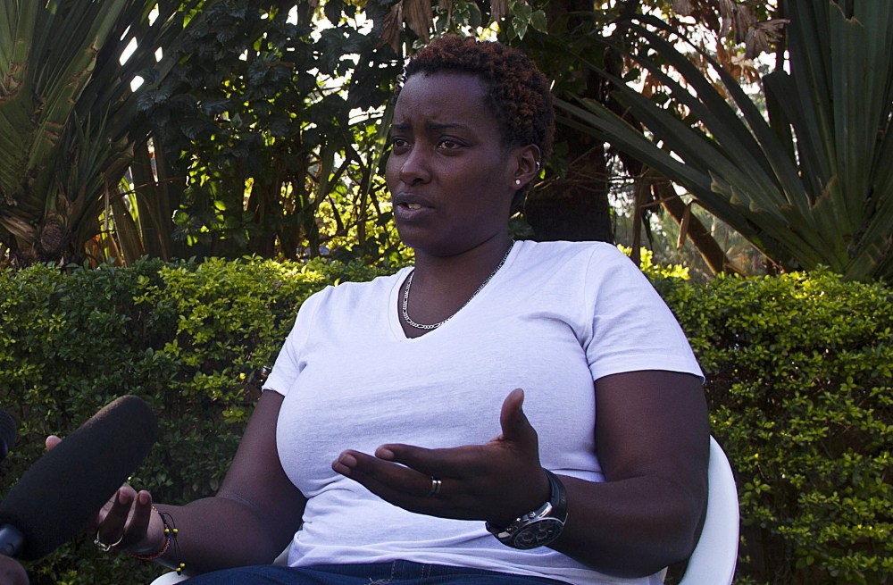 Gay rights activist Clair Byarugaba talks to journalists in Kampala on December 20, 2013.