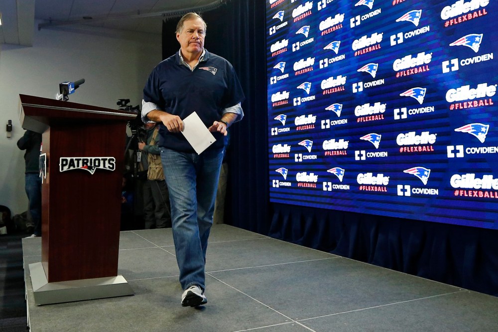 New England Patriots head coach Bill Belichick walks from the podium after a news conference prior to a team practice in Foxborough, Mass., on Jan. 22, 2015. (Photo by Elise Amendola/AP)