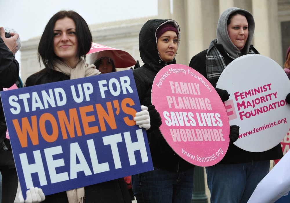 File photo: Pro-choice activists hold placards during a rally outside of the Supreme Court on January 23, 2012 in Washington, DC.  (Photo: Mandel Ngan/AFP Photo)