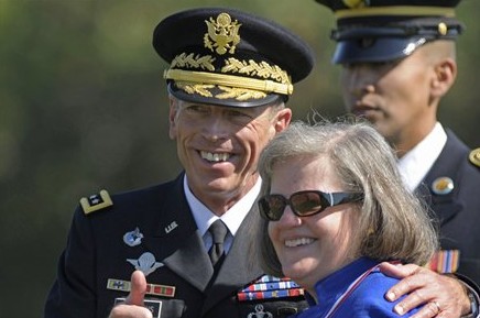 FILE - In this Aug. 31, 2011 file photo, former Commander of International Security Assistance Force and U.S. Forces-Afghanistan Gen. Davis Petraeus, standing with his wife Holly, participates in an armed forces farewell tribute and retirement ceremony...