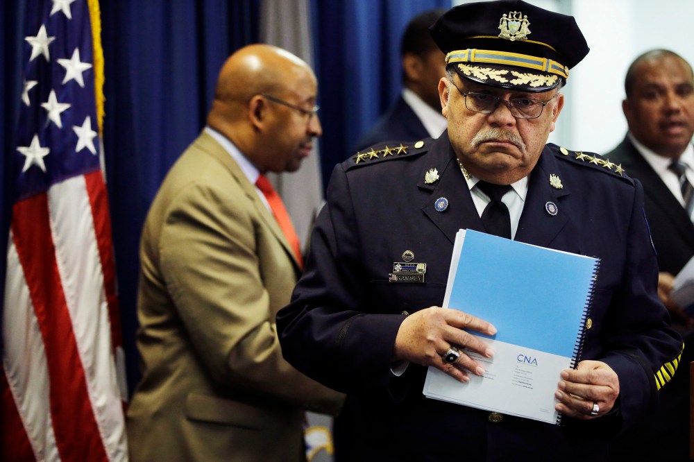 Philadelphia Police Commissioner Charles Ramsey holds a newly released report during a news conference on March 23, 2015, in Philadelphia. (Photo by Matt Rourke/AP)