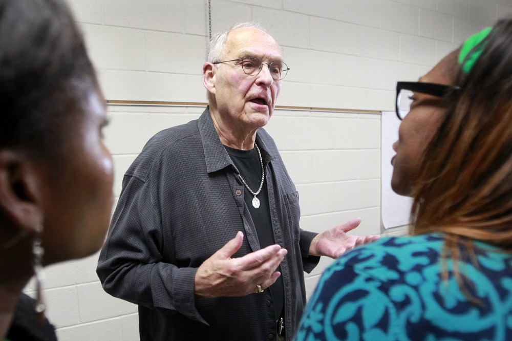 Wolfeboro Police Commissioner Robert Copeland is confronted by Whitney White, right, and Elizabeth Smith after a meeting on May 15, 2014 in Wolfeboro,  N.H.