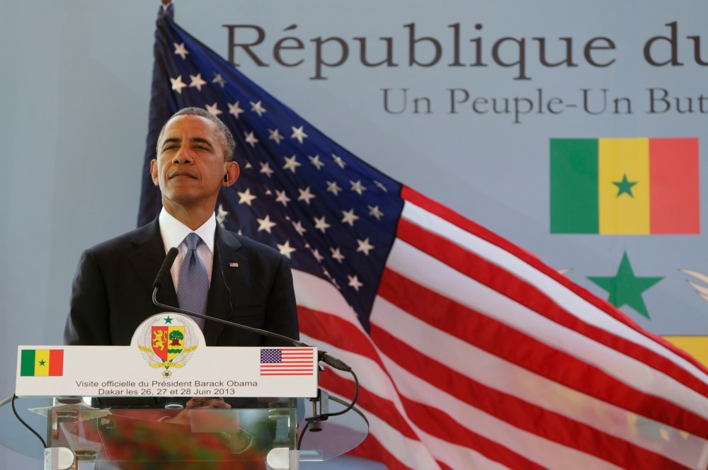 U.S. President Barack Obama listens to a question during a joint news conference with Senegal's President Macky Sall (not pictured) at the Presidential Palace in Dakar June 27, 2013. (Photo by Gary Cameron/Reuters)
