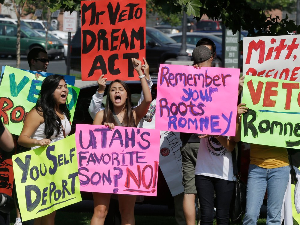Immigration activists protest outside of The Grand America in Salt Lake City, Utah, where Republican presidential candidate and former Massachusetts Gov. Mitt Romney is holding a campaign fundraising event, Tuesday, Sept. 18, 2012. (Photo by Charles...