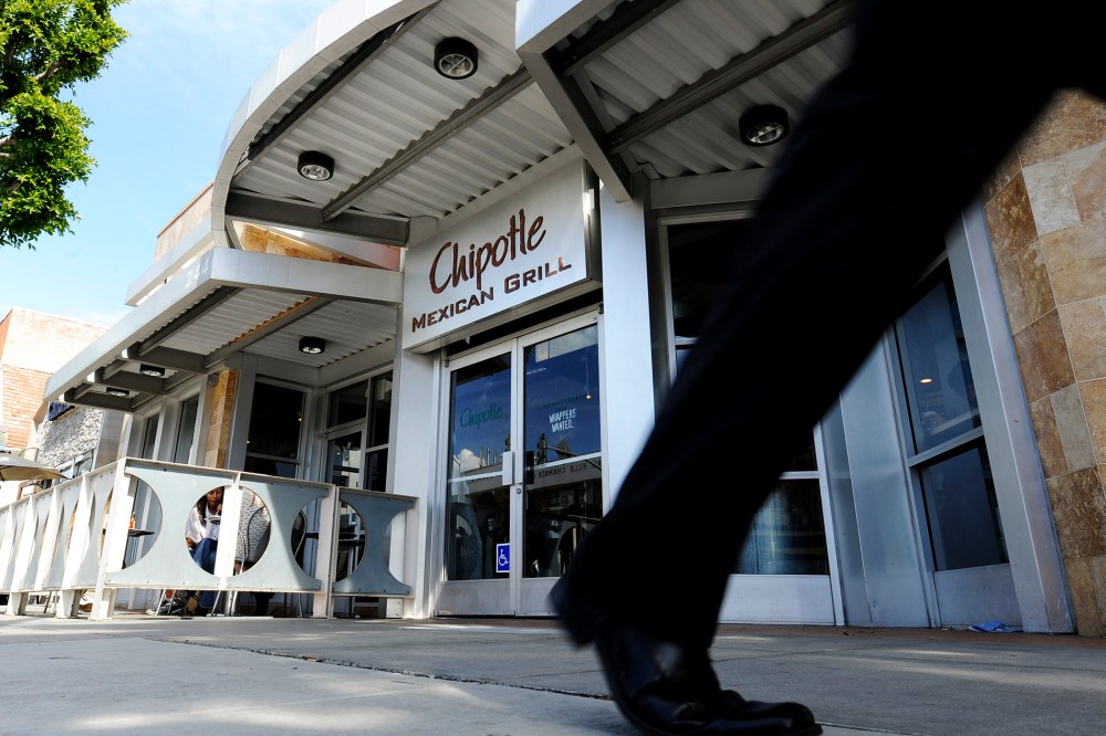 A pedestrian walks past a Chipotle Mexican Grill in Beverly Hills