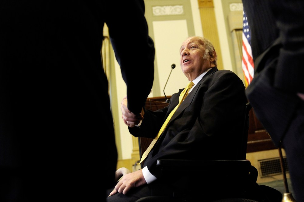 Brady greets people as he arrives for a news conference to urge members of Congress for progress on gun control legislation in Washington