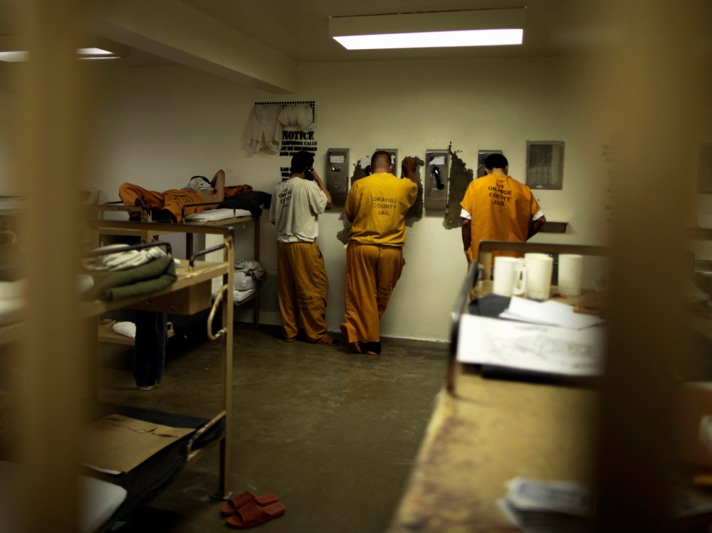 Inmates make phone calls from their cell at the Orange County jail in Santa Ana, California, May 24, 2011.