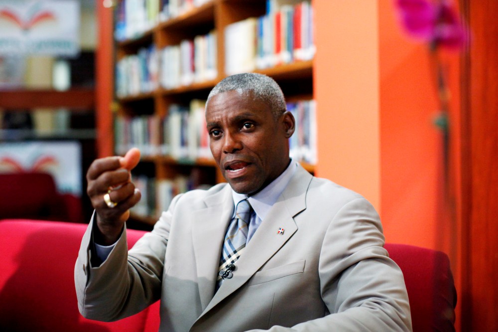 Carl Lewis speaks during a interview with local media in Santo Domingo.