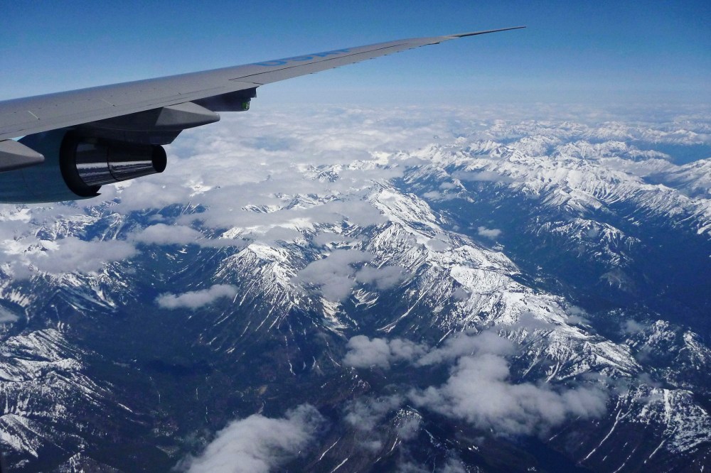 A plane flies over the Cascade Range as it heads towards Seattle.