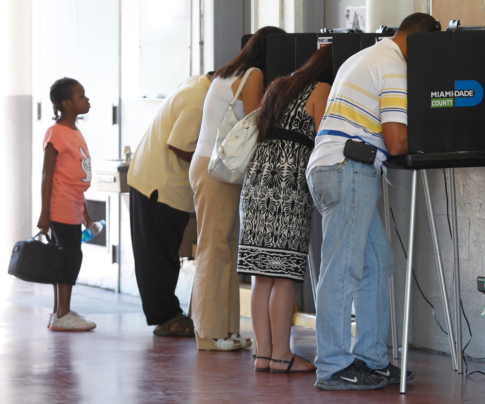 People vote during the U.S. presidential election in North Miami Beach, Florida November 6, 2012.