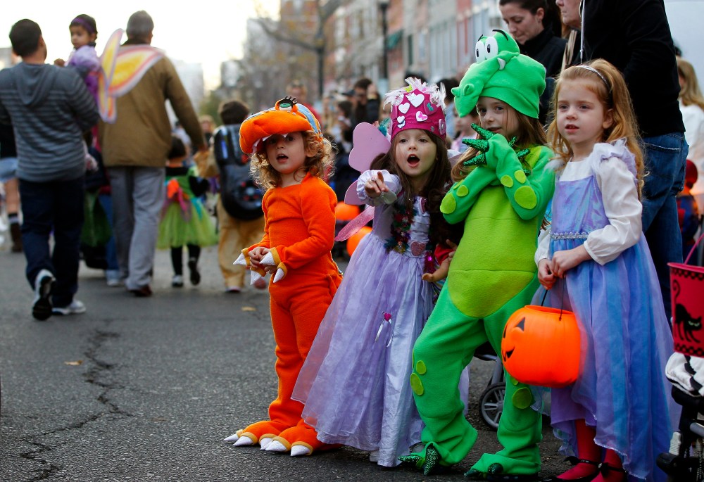 Children participate in the postponed annual Ragamuffin Halloween Parade in Hoboken