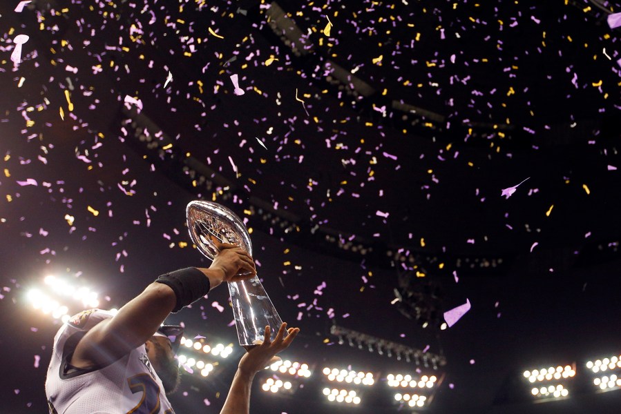 Baltimore Ravens free safety Ed Reed holds up the Vince Lombardi Trophy after his team defeated the San Francisco 49ers in the NFL Super Bowl XLVII football game in New Orleans, La., Feb., 3, 2013.