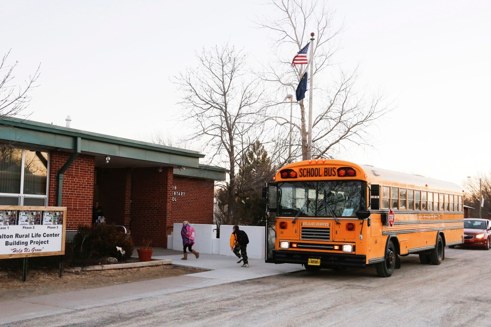 Students arrive at the Walton Rural Life Center Elementary School, in Walton, Kansas, January 18, 2013.