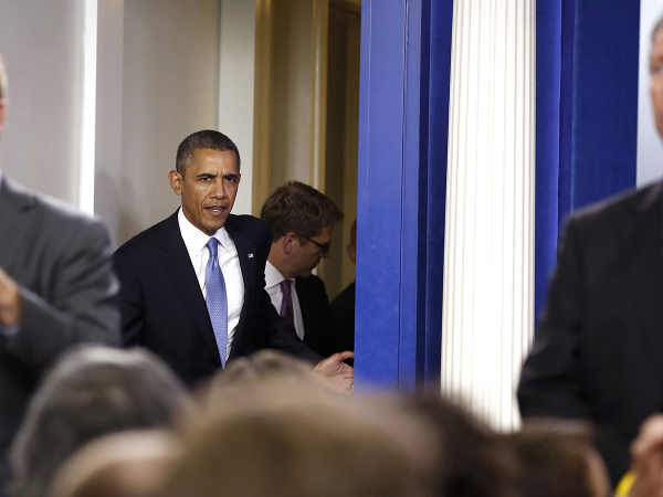 U.S. President Barack Obama walks out before he makes a statement to the media about the government shutdown in the briefing room of the White House in Washington