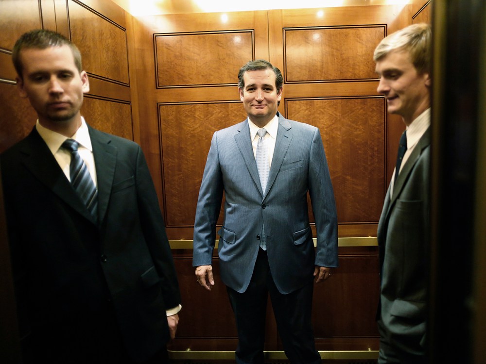 U.S. Senator Cruz departs the Senate floor after a late-night vote rejected budget legislation from the Republican-controlled House of Representatives at the U.S. Capitol in Washington