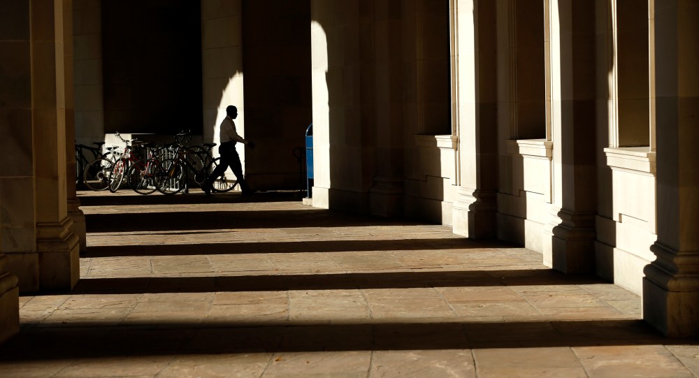 A lone worker enters Woodrow Wilson Plaza at Federal Triangle in Washington October 2, 2013.