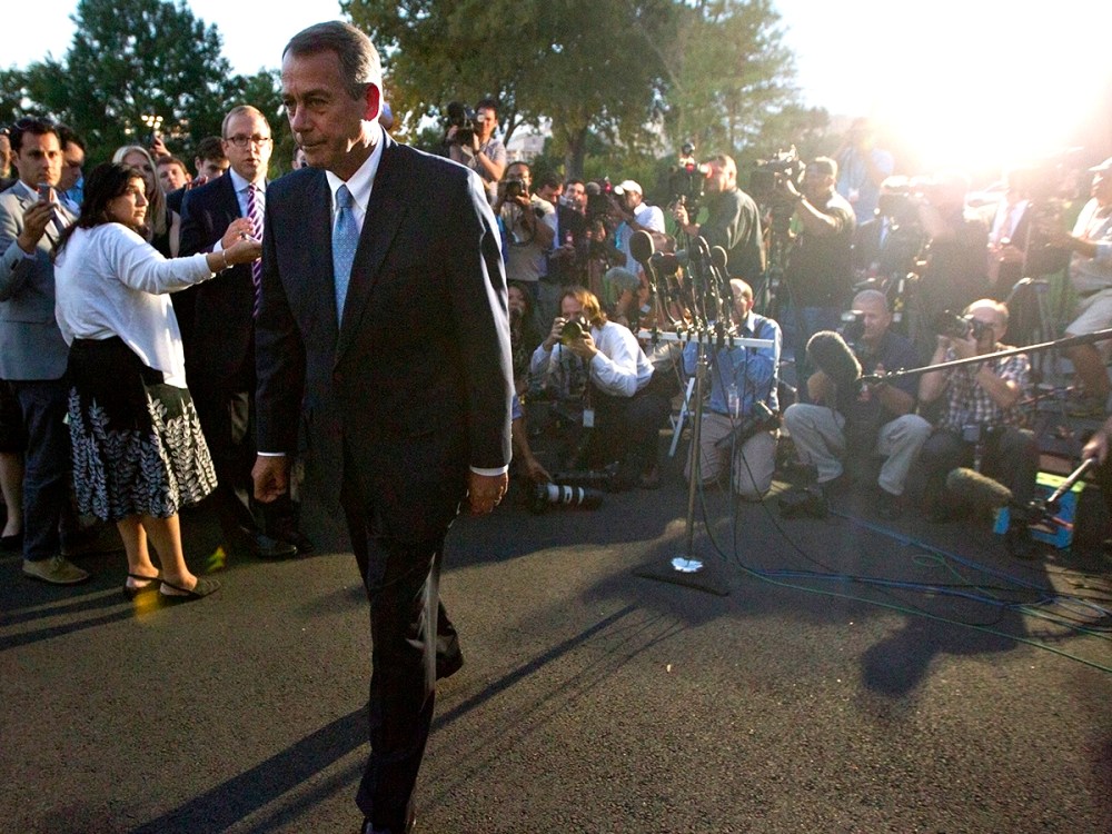 U.S. House Speaker Boehner leaves after a meeting with U.S. President Obama, outside the West Wing of the White House in Washington