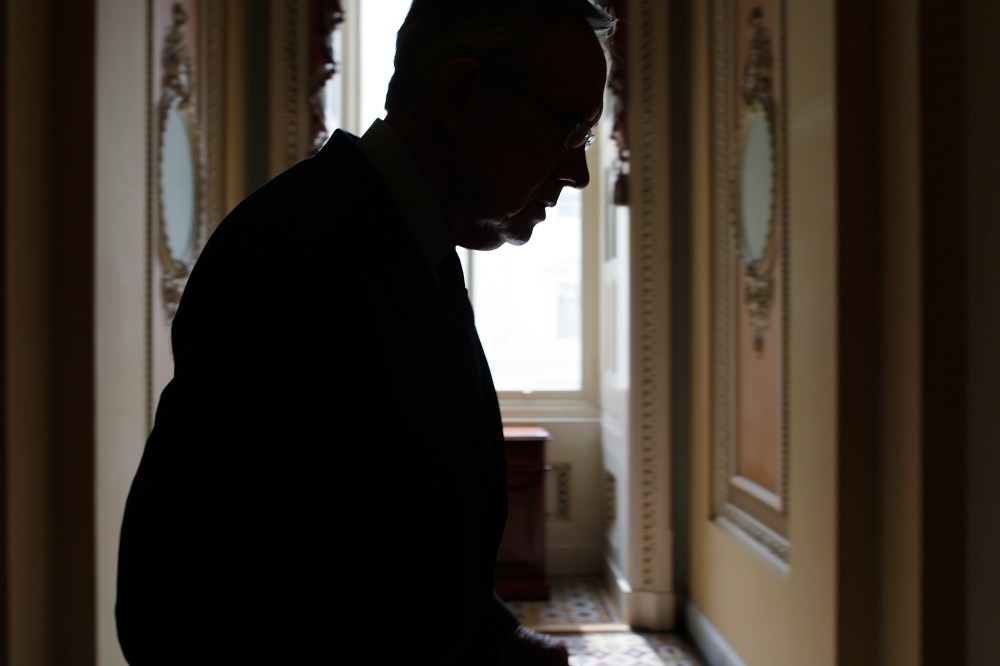 U.S. Senate Majority Leader Harry Reid returns to his office after a news conference at the U.S. Capitol in Washington on Oct. 3, 2013.