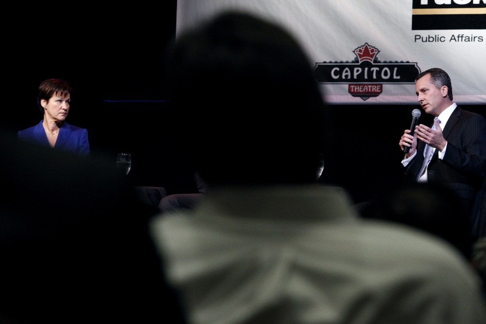 Democrat Alex Sink (L) and Republican David Jolly (R), both candidates for Florida's congressional District 13, participate in a candidate forum in Clearwater, Fla. on Feb. 25, 2014.