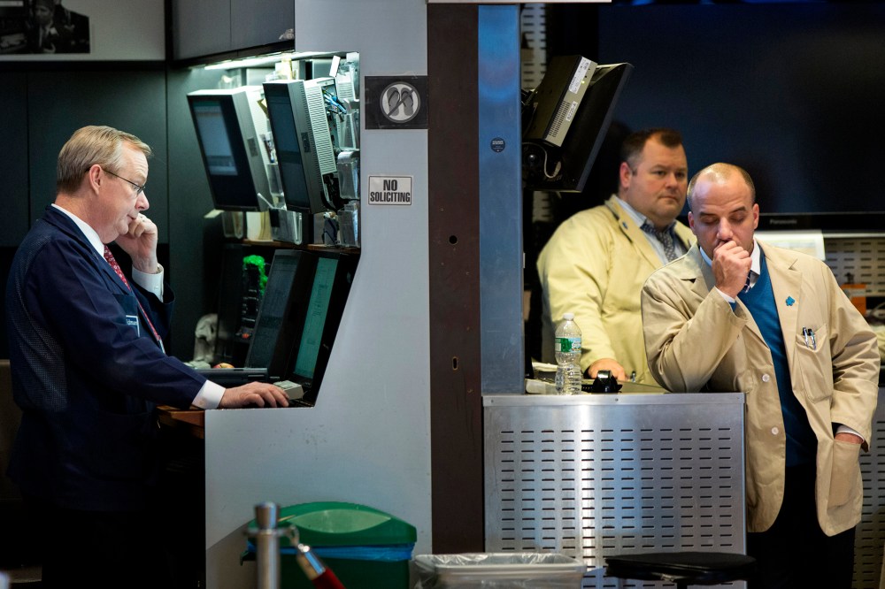 Traders work on the floor of the New York Stock Exchange