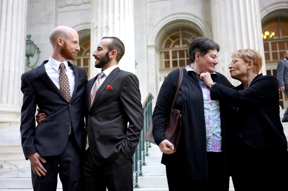 Plaintiffs talk outside the courthouse after a federal appeals court heard oral arguments on a Utah state law forbidding gays and lesbians from marrying in Denver