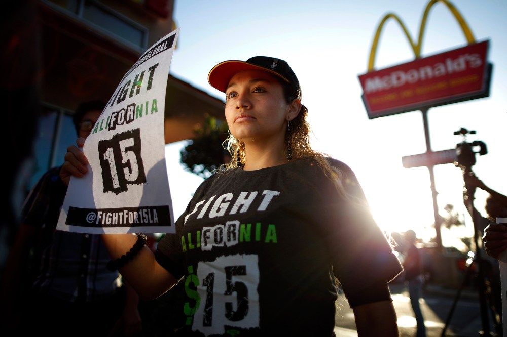Demonstrators take part in a protest to demand higher wages for fast-food workers outside McDonald's in Los Angeles, Cali. on May 15, 2014.