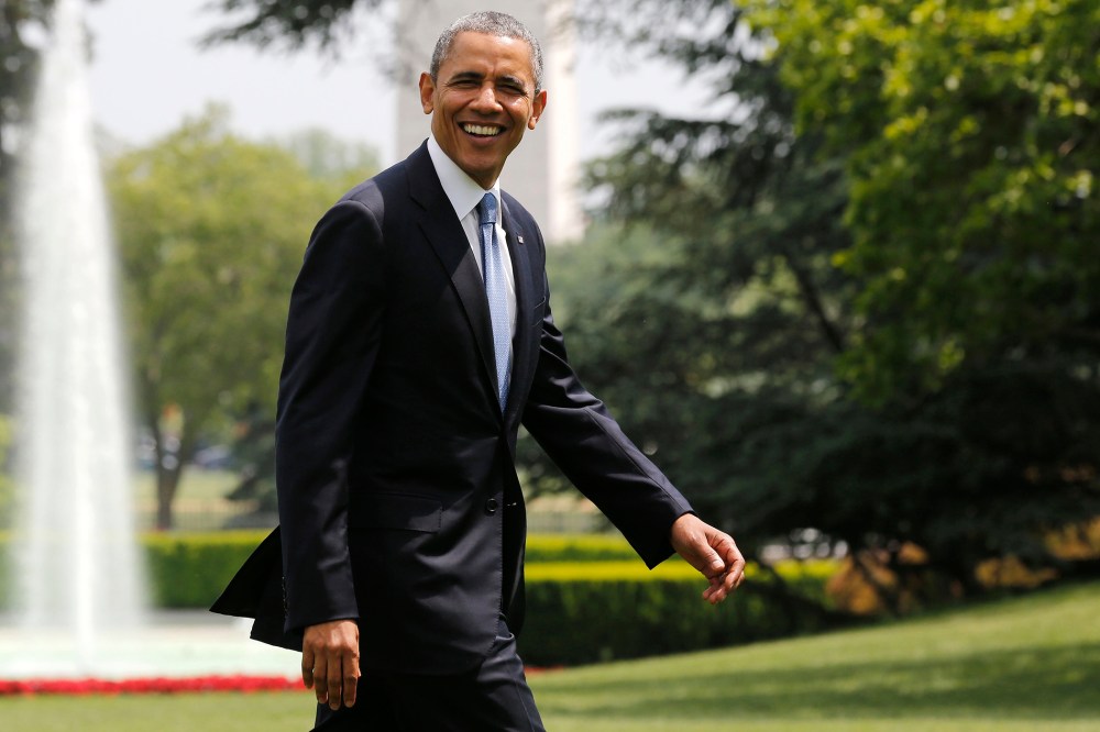 U.S. President Barack Obama smiles as he walks away from Marine One on the South Lawn at the White House in Washington, D.C., May 28, 2014.
