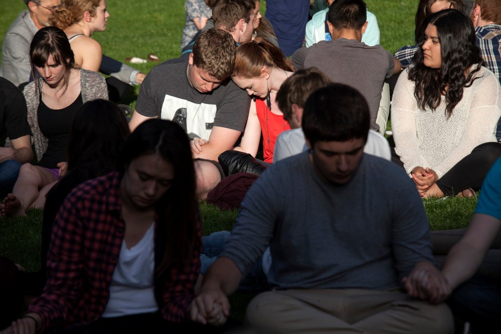 Students pray together after a shooting on campus at Seattle Pacific University in Washington