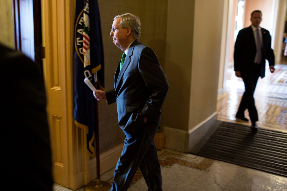 Senate Minority Leader McConnell (R-KY) returns to his office after the Republican caucus meeting on Capitol Hill in Washington