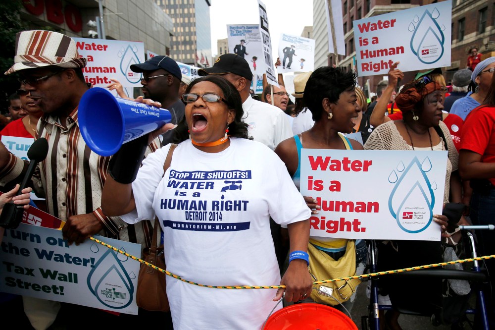 People gather to protest against the mass water shut-offs to Detroit citizens behind in their payments, July 18, 2014.
