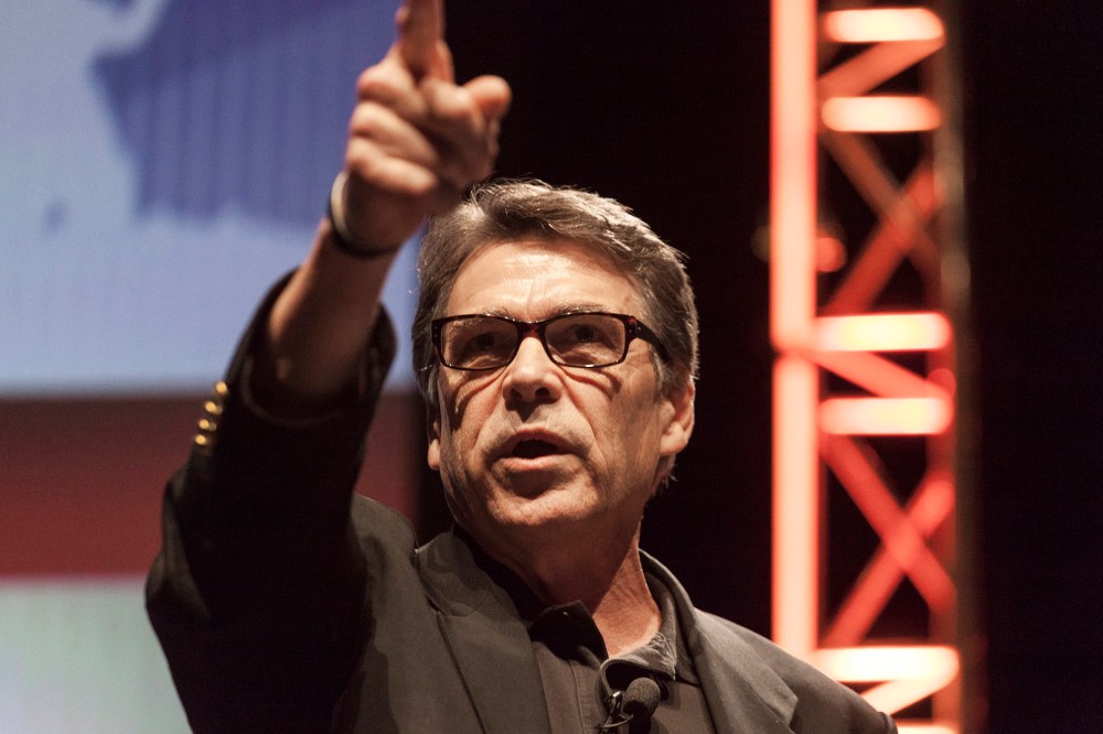 Texas Governor Rick Perry gestures as he speaks at the Family Leadership Summit in Ames, Iowa August 9, 2014.