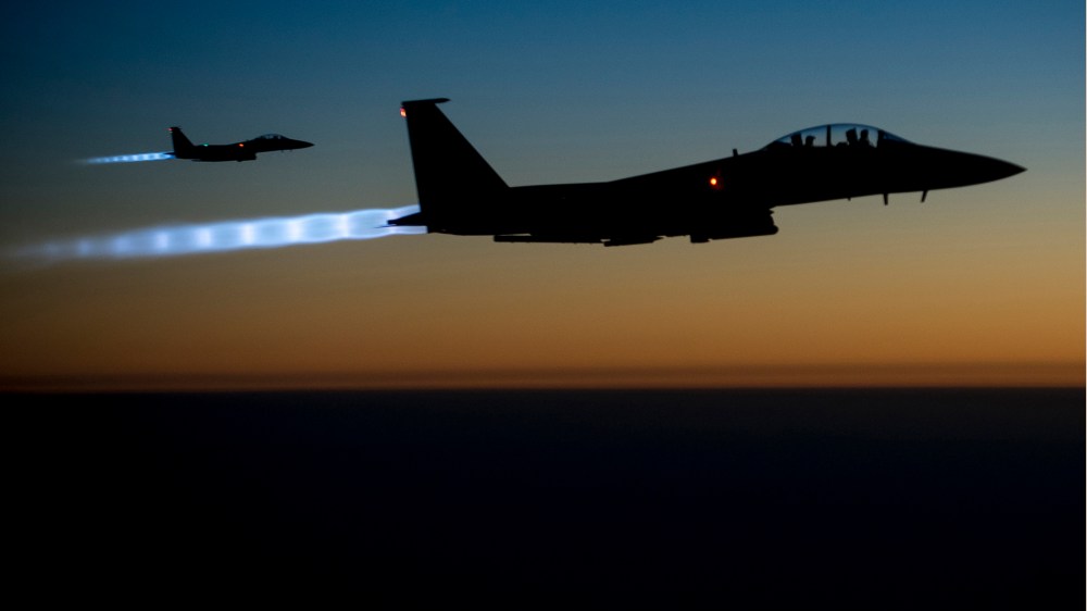 A pair of U.S. Air Force F-15E Strike Eagles fly over northern Iraq after conducting airstrikes in Syria, in this U.S. Air Force handout photo taken early in the morning of September 23, 2014. (Senior Airman Matthew Bruch/Handout/US Air Force/Reuters)