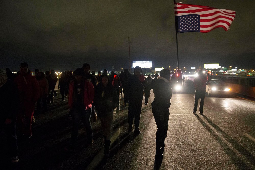 Protesters block Highway 170, after a man was fatally shot by a police man in Berkeley, Mo on Dec. 24, 2014.