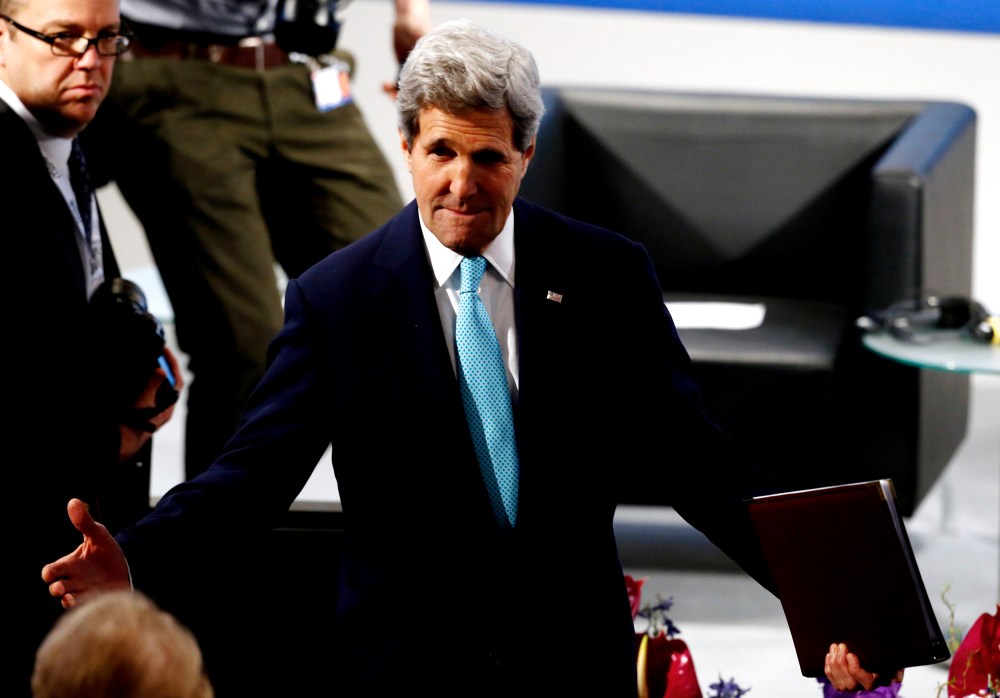 US Secretary of State John Kerry gestures as he arrives for the chairman's debate at the 51st Munich Security Conference in Munich, Feb. 8, 2015. (Photo by Michael Dalder/Reuters)