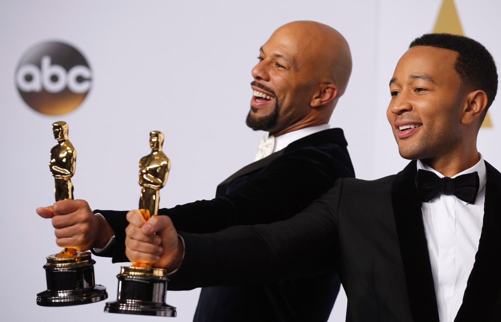 Singers Common and John Legend take the stage to pose with their Oscars after winning the award for best original song for "Glory" from the film "Selma" during the 87th Academy Awards in Hollywood, Calif., Feb. 22, 2015. (Photo by Lucy Nicholson/Reuters)