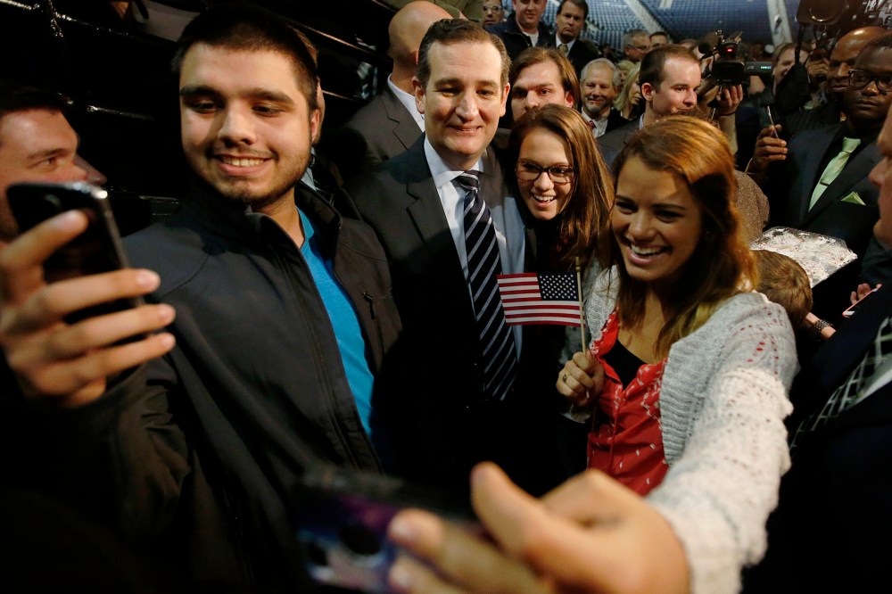 US Senator Ted Cruz (R-TX) poses for pictures with students shooting "selfies" after confirming his candidacy for the 2016 presidential election race during a speech at Liberty College in Lynchburg, Va., March 23, 2015. (Photo by Chris Keane/Reuters)