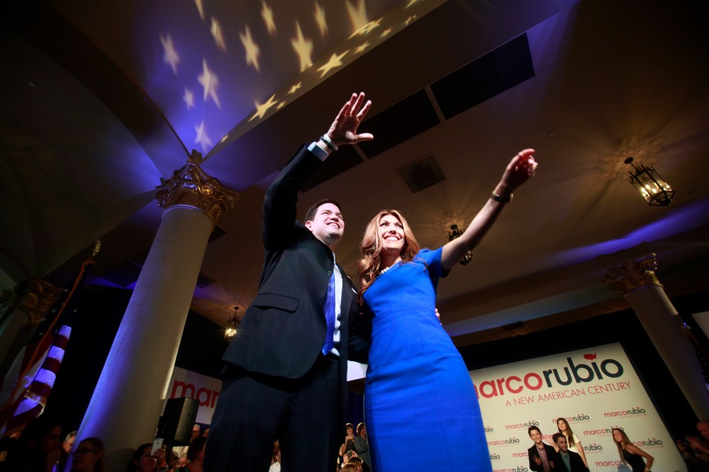 U.S. Senator Marco Rubio (R-FL) waves to the crowd with his wife Jeanette after he announced his bid for the Republican nomination in the 2016 U.S. presidential election race in Miami, Florida April 13, 2015. (Photo by Carlo Allegri/Reuters)