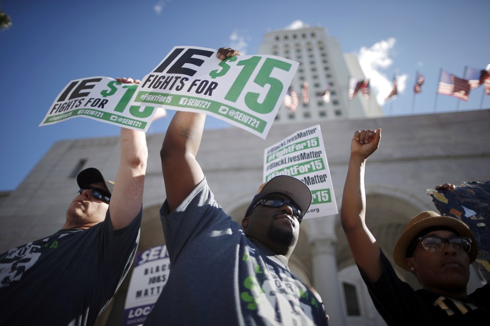 Fast-food workers and their supporters join a nationwide protest for higher wages and union rights outside City Hall in Los Angeles, Calif, Nov. 10, 2015. (Photo by Lucy Nicholson/Reuters