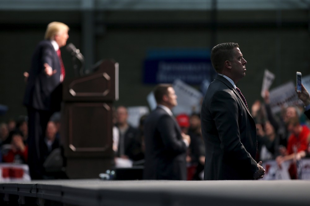 A member of the secret Service guard Republican presidential candidate Donald Trump as he attends a campaign rally in Warren, Mich., March 4, 2016. (Photo by Carlos Barria/Reuters)