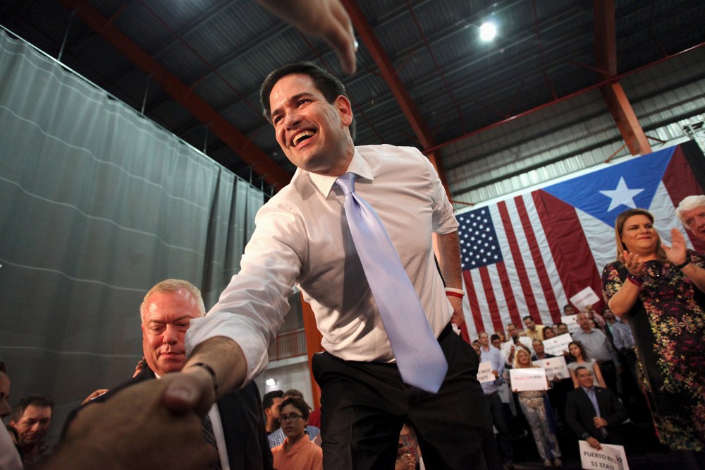 Republican U.S. presidential candidate Florida Senator Marco Rubio shakes hands with supporters while campaigning in Toa Baja, Puerto Rico, March 5, 2016. (Photo by Alvin Baez/Reuters)