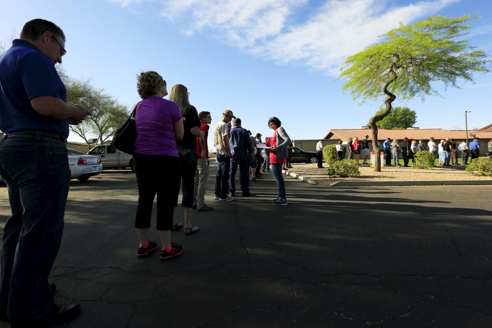 People wait to vote in the U.S. presidential primary election outside a polling site in Glendale, Ariz. on March 22, 2016. (Photo by Nancy Wiechec/Reuters)