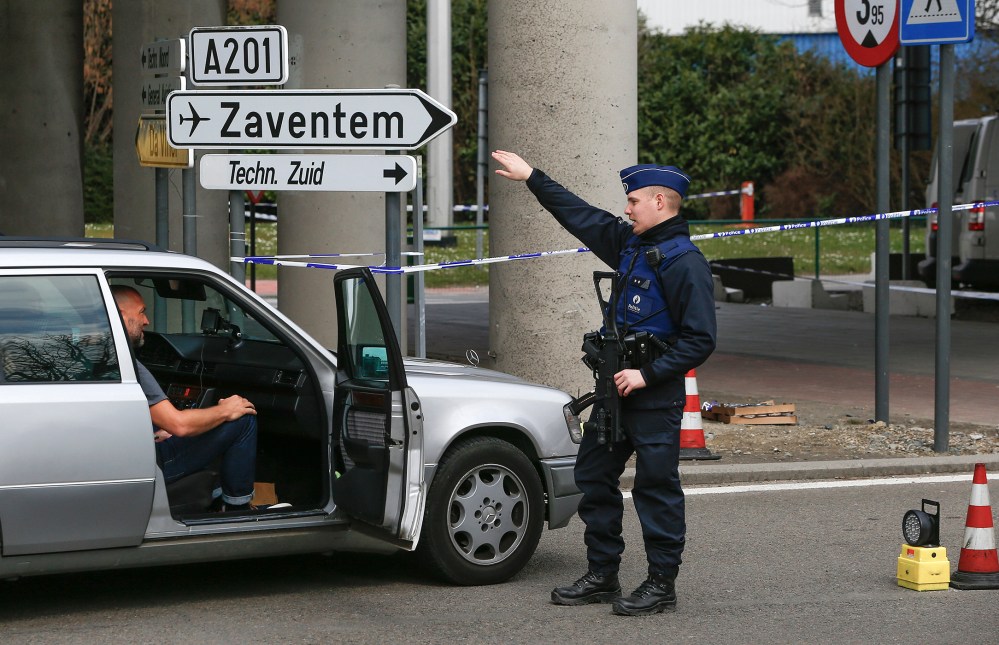 A Belgian police officer controls the access to Belgian international airport of Zaventem airport, in Zaventem, Belgium, April 1, 2016. (Photo by Yves Herman/Reuters)