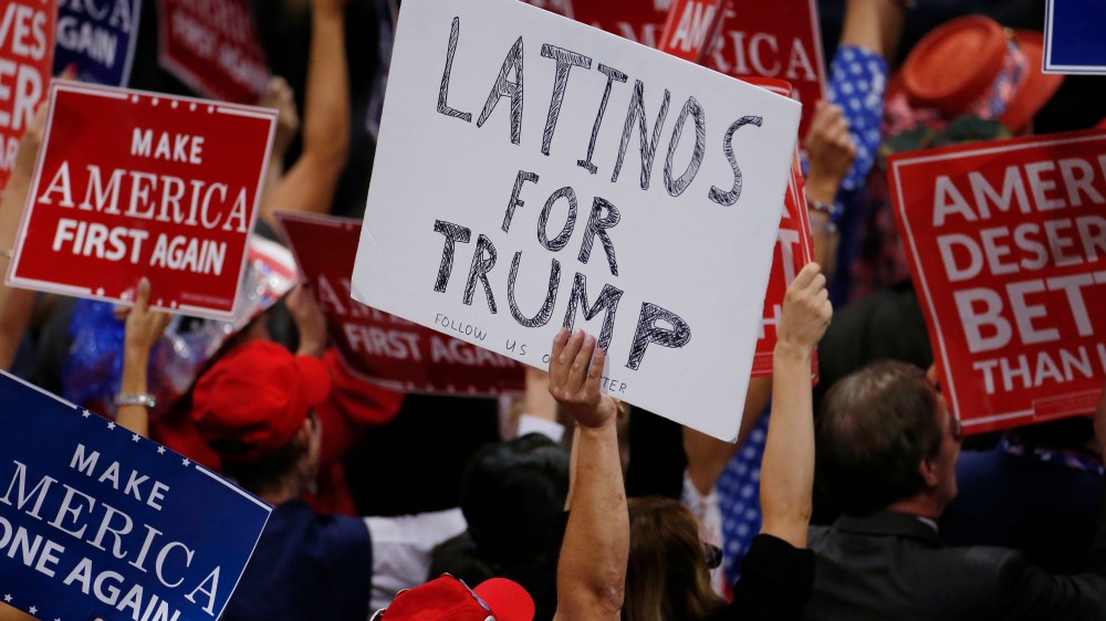 A person holds a sign reading 'Latinos for Trump' on the third day of the Republican National Convention in Cleveland, Ohio, July 20, 2016. (Photo by Carlo Allegri/Reuters)