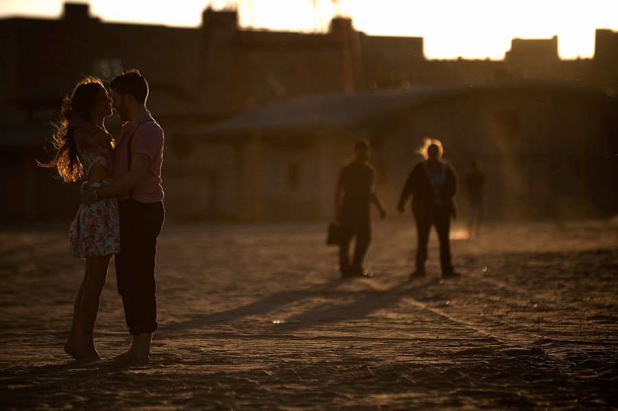 A couple embraces on the beach at Coney Island in the Brooklyn Borough of New York, on May 26, 2013.