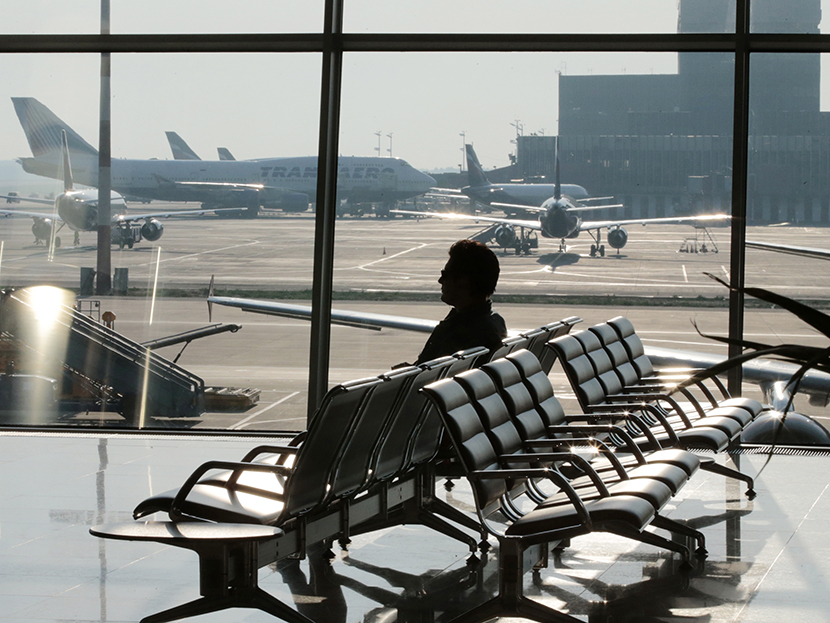 A passenger waits for his flight at Moscow's Sheremetyevo airport June 26, 2013. (Photo by Tatyana Makeyeva/Reuters)